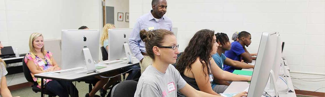 students in computer lab earning associate degrees